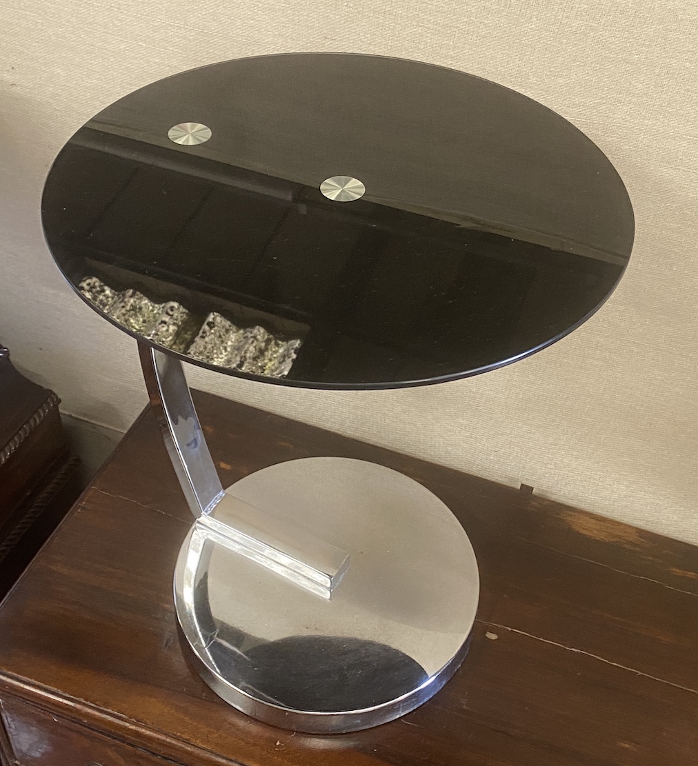 A chrome and black glass circular occasional table, diameter 45cm, height 54cm